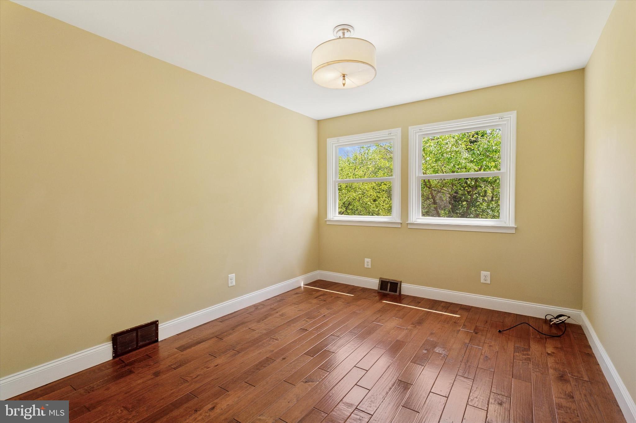 317 Hilltop Road Paoli, PA 19301 - Photo 12 of 25 a view of a room with wooden floor and windows