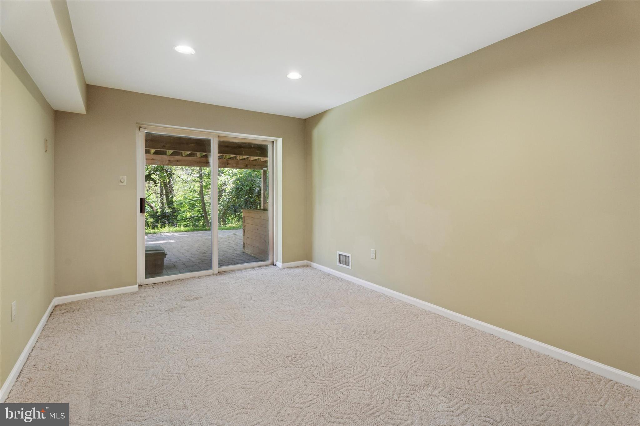 317 Hilltop Road Paoli, PA 19301 - Photo 19 of 25 an empty room with wooden floor and a window