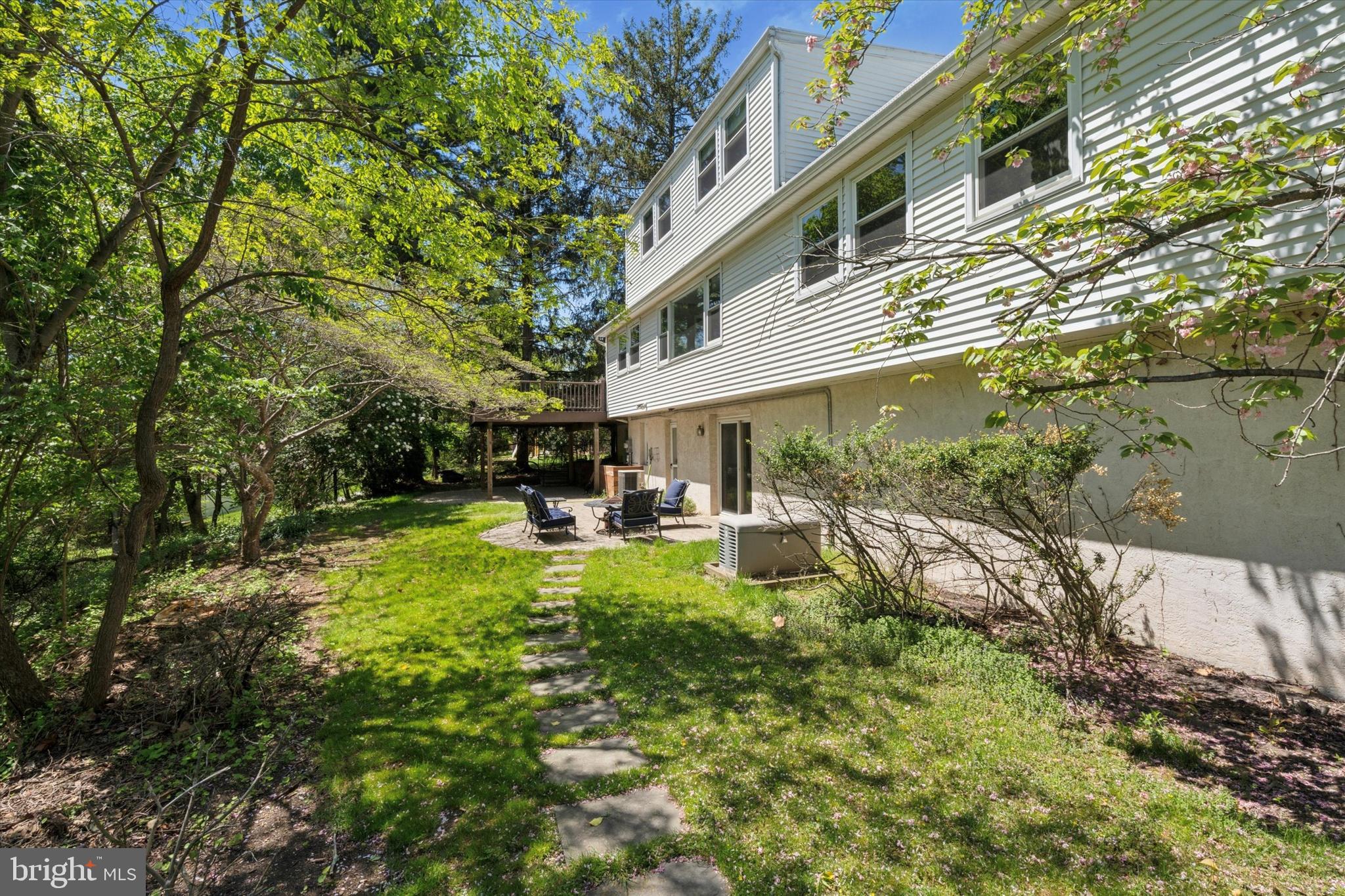 317 Hilltop Road Paoli, PA 19301 - Photo 22 of 25 a view of backyard of a house with table and chairs