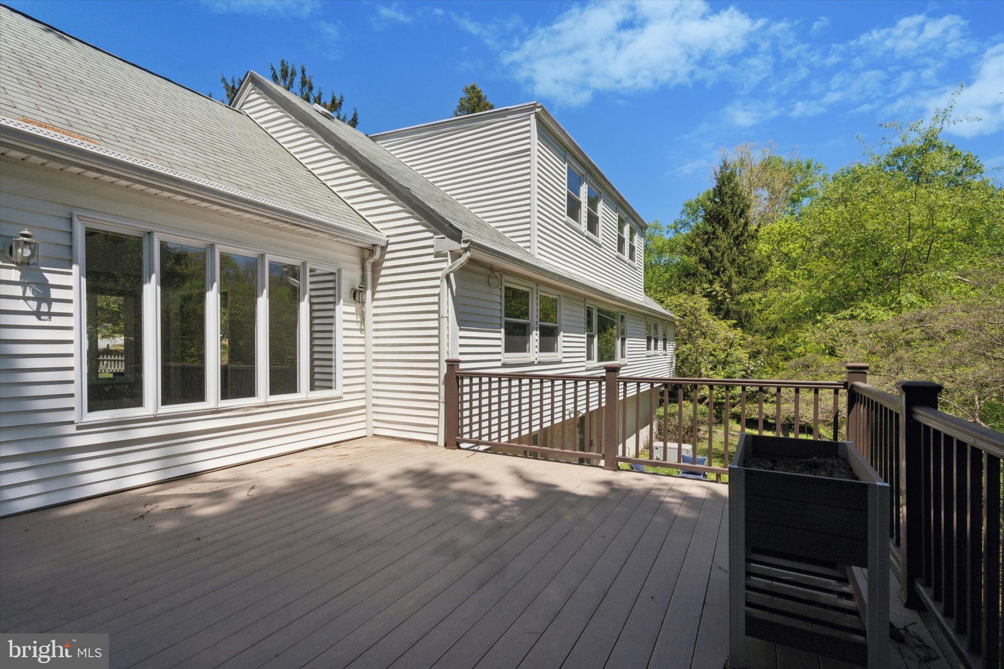 317 Hilltop Road Paoli, PA 19301 - Photo 23 of 25 a view of a house with a wooden deck