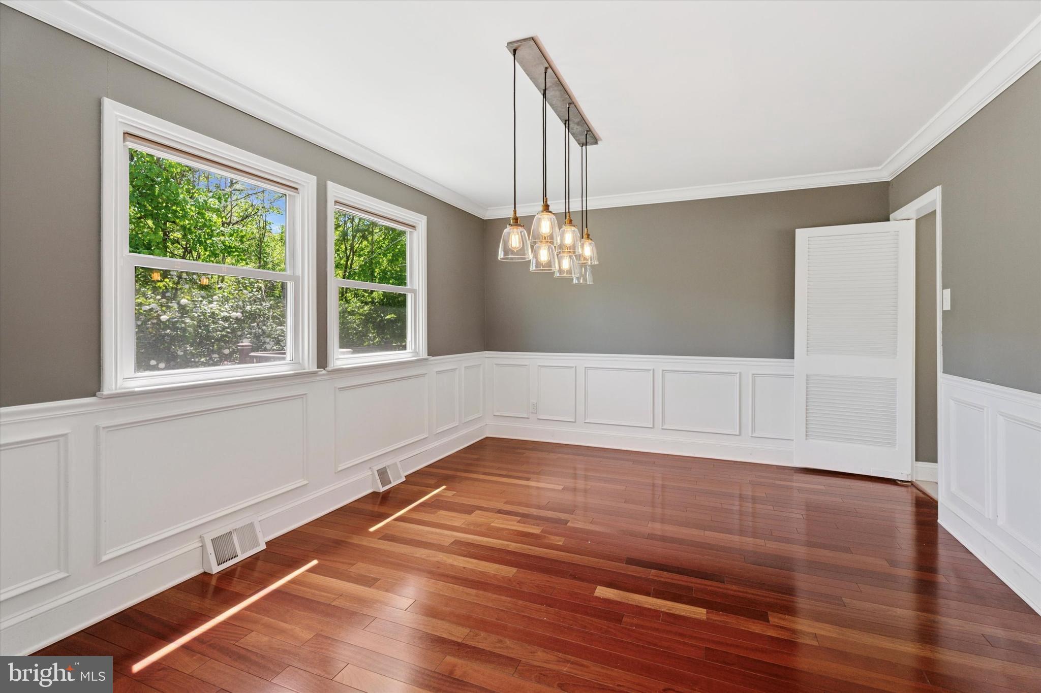 317 Hilltop Road Paoli, PA 19301 - Photo 4 of 25 a view of an empty room with wooden floor and a window