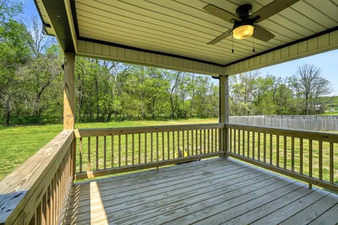 a view of a balcony with wooden floor