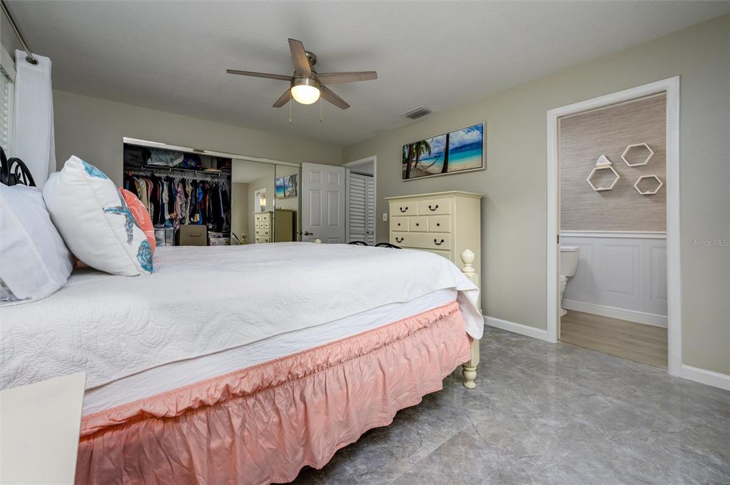 1472 Queen Anne Drive Palm Harbor, FL 34684 - Photo 19 of 34 a bedroom with bed and window