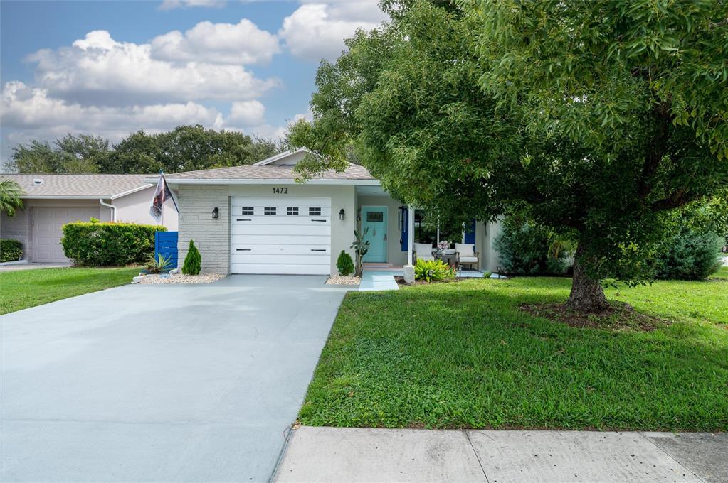 1472 Queen Anne Drive Palm Harbor, FL 34684 - Photo 2 of 34 a view of a house with a yard