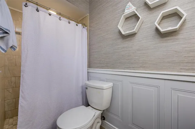 a bathroom with a toilet and a sink