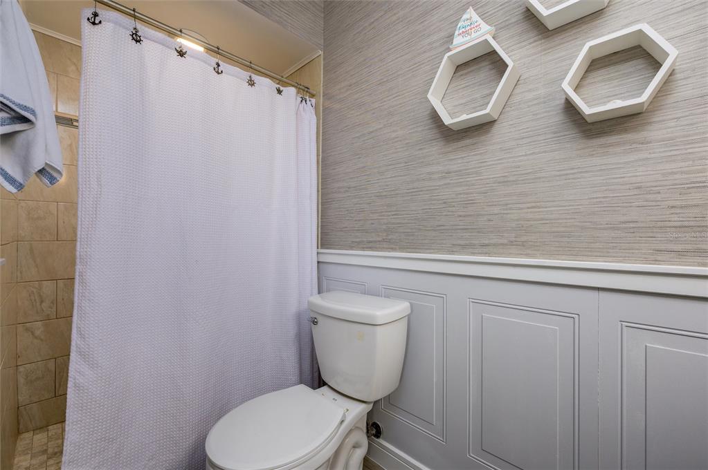 1472 Queen Anne Drive Palm Harbor, FL 34684 - Photo 21 of 34 a bathroom with a toilet and a sink