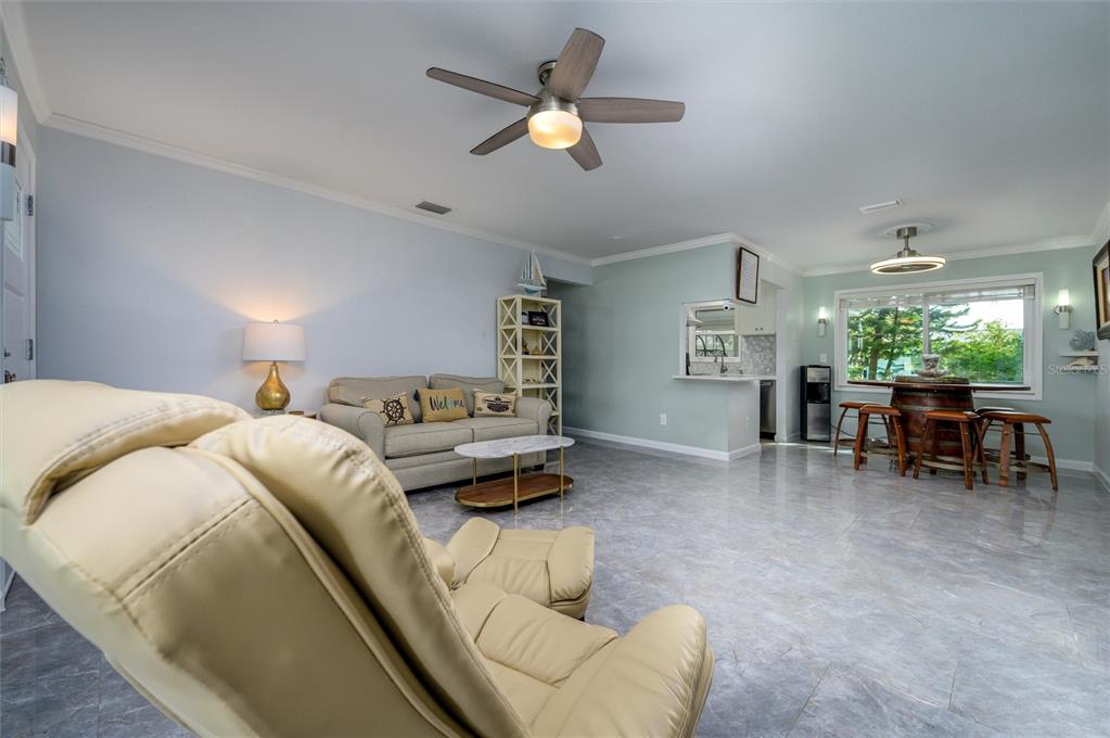 1472 Queen Anne Drive Palm Harbor, FL 34684 - Photo 5 of 34 a bed room with a bed and a chair