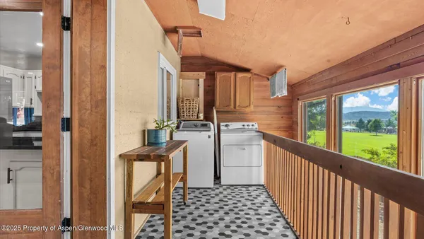 a view of a kitchen with a sink and dishwasher