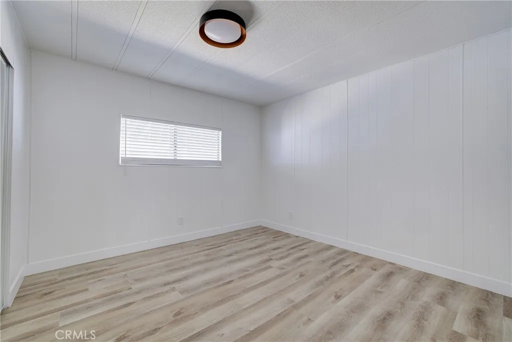 3700 Buchanan Street, Unit 164 Riverside, CA 92503 - Photo 21 of 40 an empty room with wooden floor