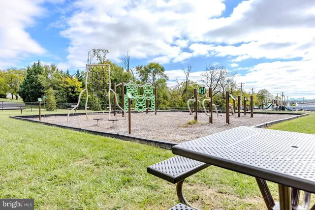 a view of a lake with a bench in the background