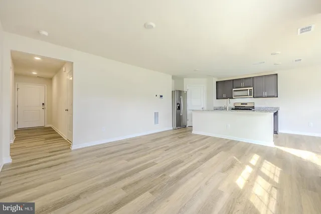 a front view of house with flowers