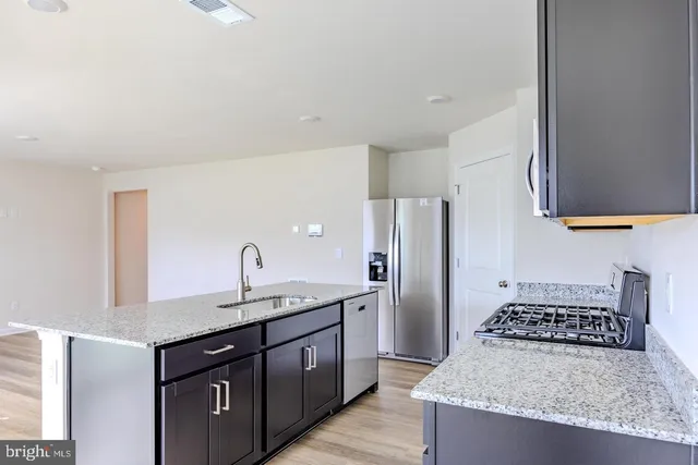 a view of kitchen with wooden floor