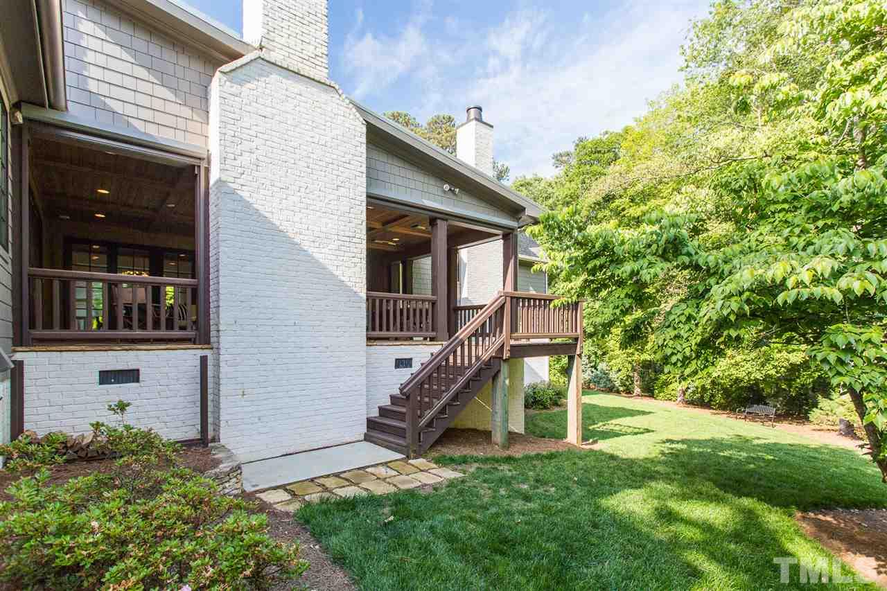 1613 Ridge Road Raleigh, NC 27607 - Photo 3 of 30 a view of a house with a small yard and a large tree