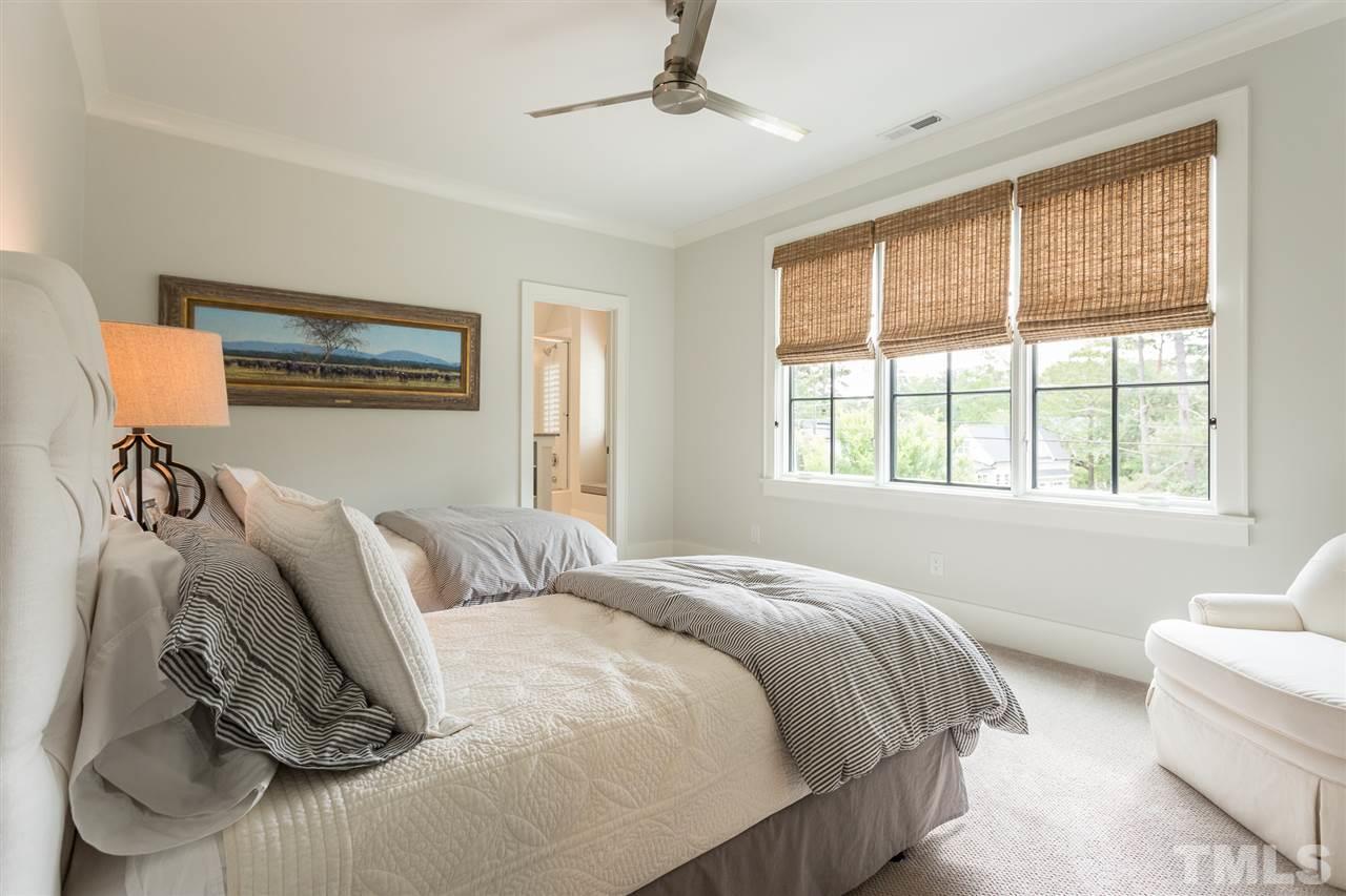 1613 Ridge Road Raleigh, NC 27607 - Photo 23 of 30 a bedroom with a bed and a window
