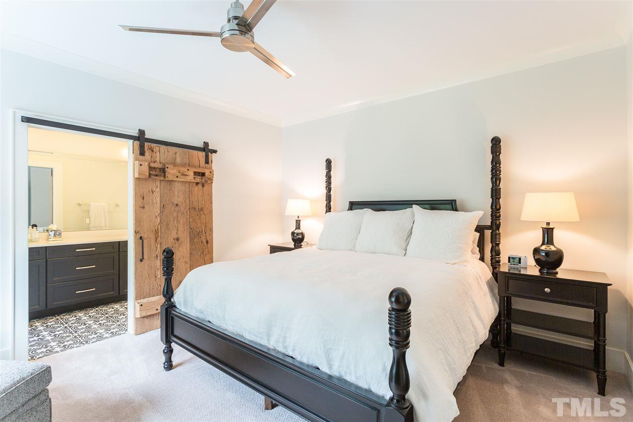 1613 Ridge Road Raleigh, NC 27607 - Photo 26 of 30 a bedroom with a bed and a window