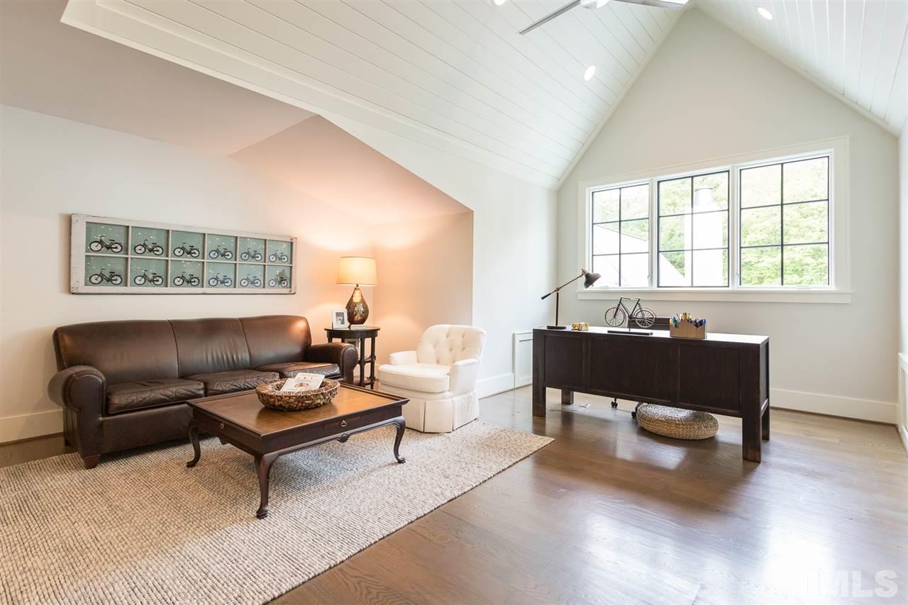 1613 Ridge Road Raleigh, NC 27607 - Photo 28 of 30 a living room with furniture and a window