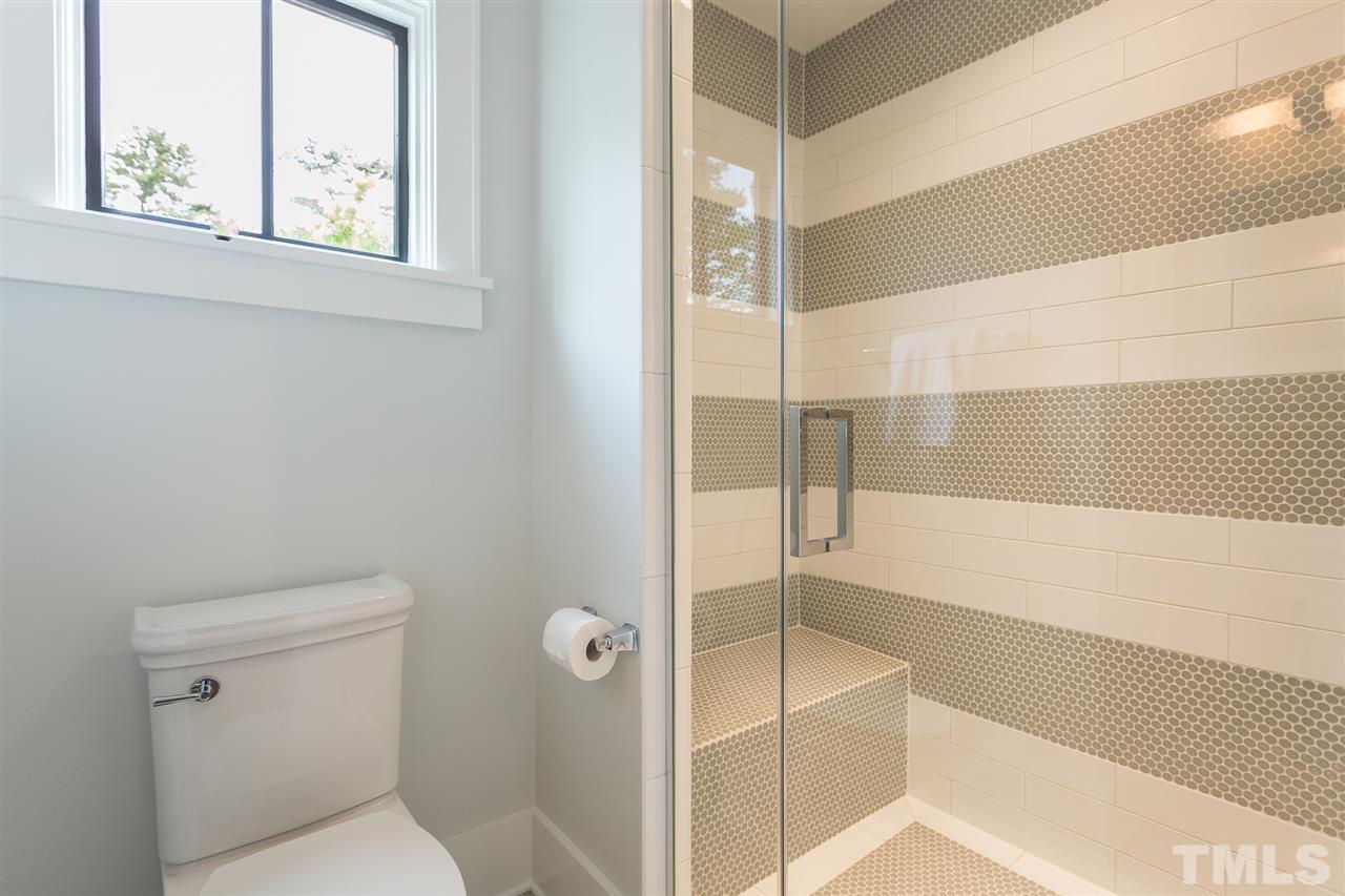1613 Ridge Road Raleigh, NC 27607 - Photo 29 of 30 a bathroom with a bathtub and a shower