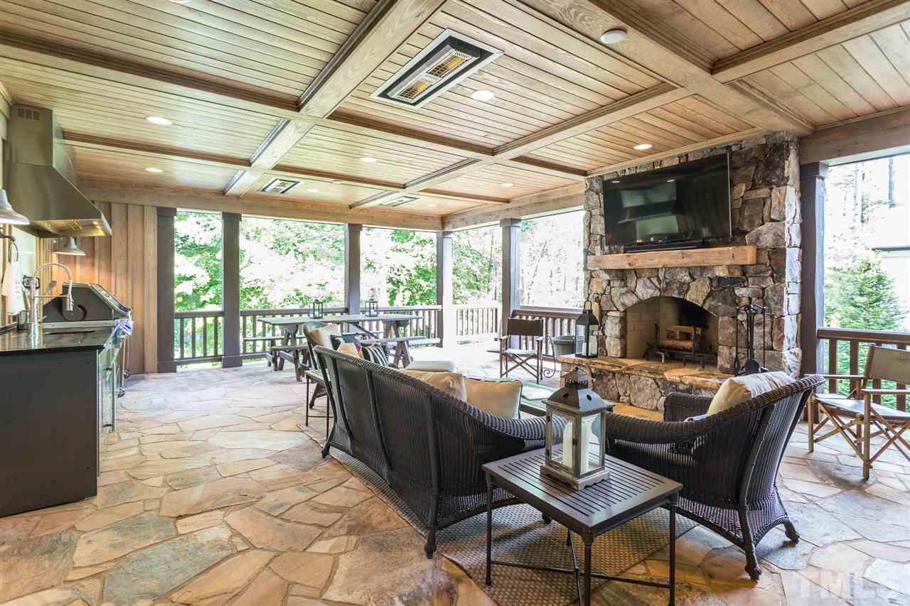1613 Ridge Road Raleigh, NC 27607 - Photo 6 of 30 a living room with fireplace furniture and a large window