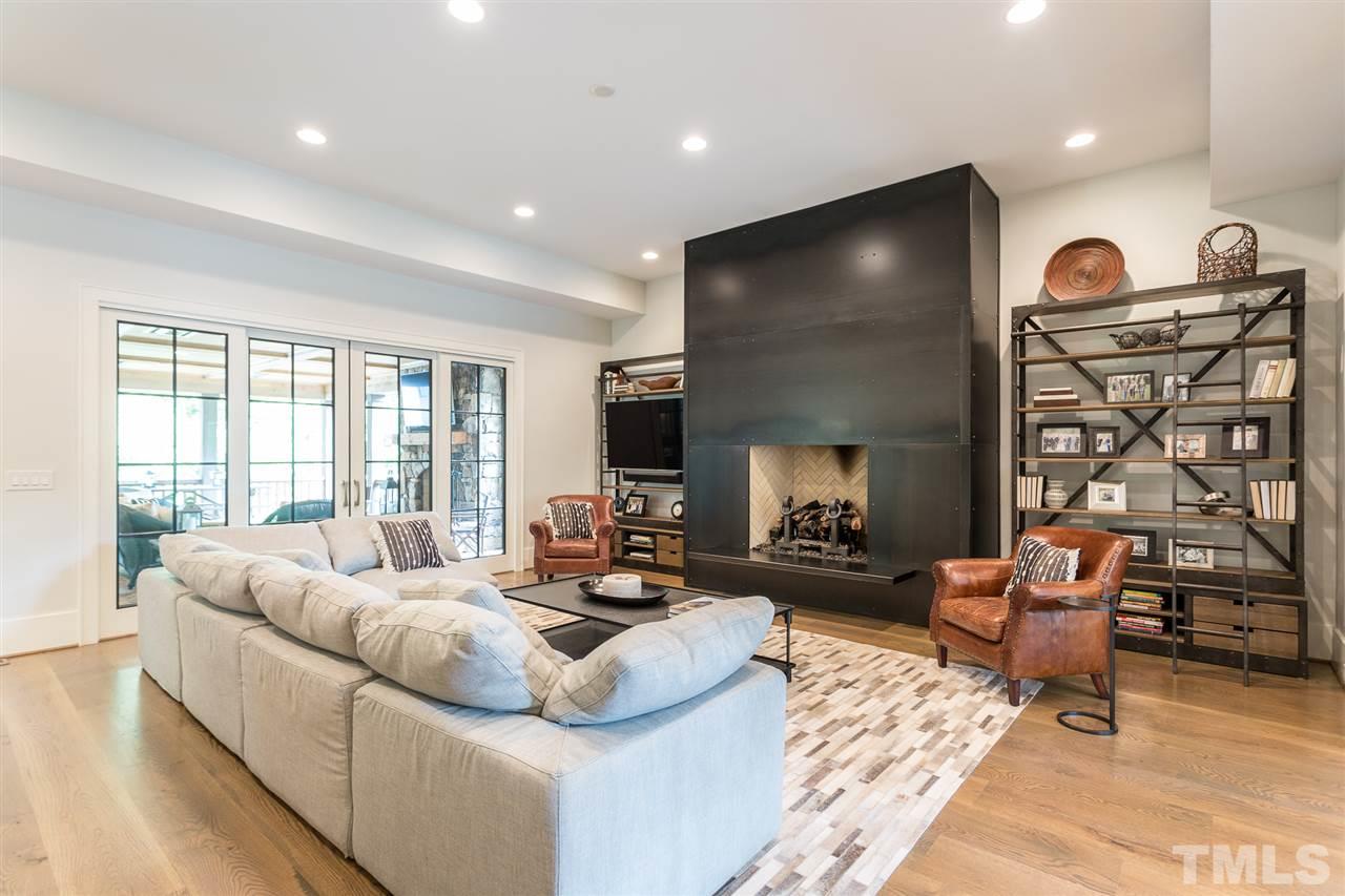 1613 Ridge Road Raleigh, NC 27607 - Photo 8 of 30 a living room with fireplace furniture and a flat screen tv