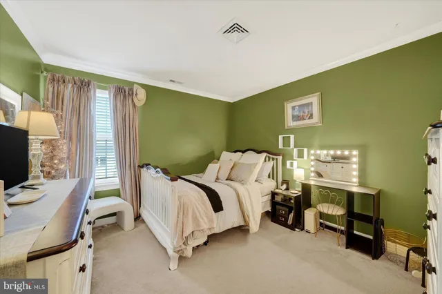 a bed room with furniture and a flat screen tv