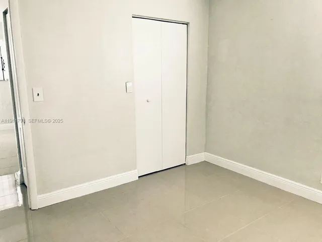 an empty room with a door