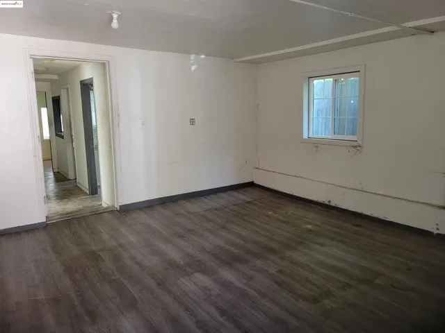 a view of a backyard with a tree