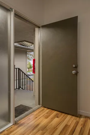 a view of a hallway with a chandelier
