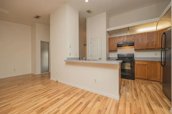 a kitchen with a sink cabinets and stainless steel appliances