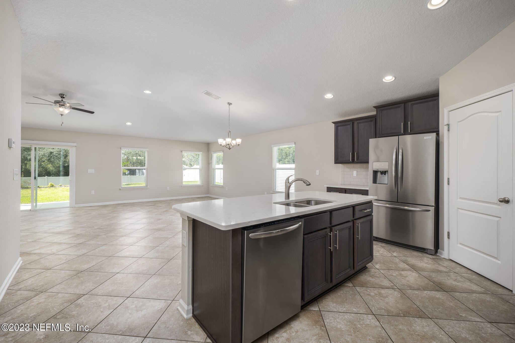 Kitchen overlooking living and dining