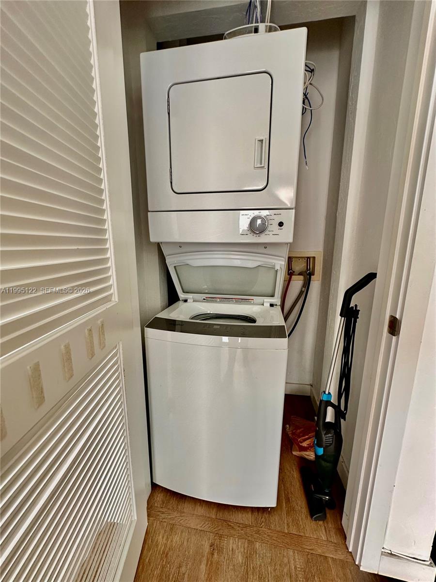 4203 Southwest 15th Street, Unit 2 Miami, FL 33145 - Photo 15 of 17 a utility room with wooden floor washer and dryer