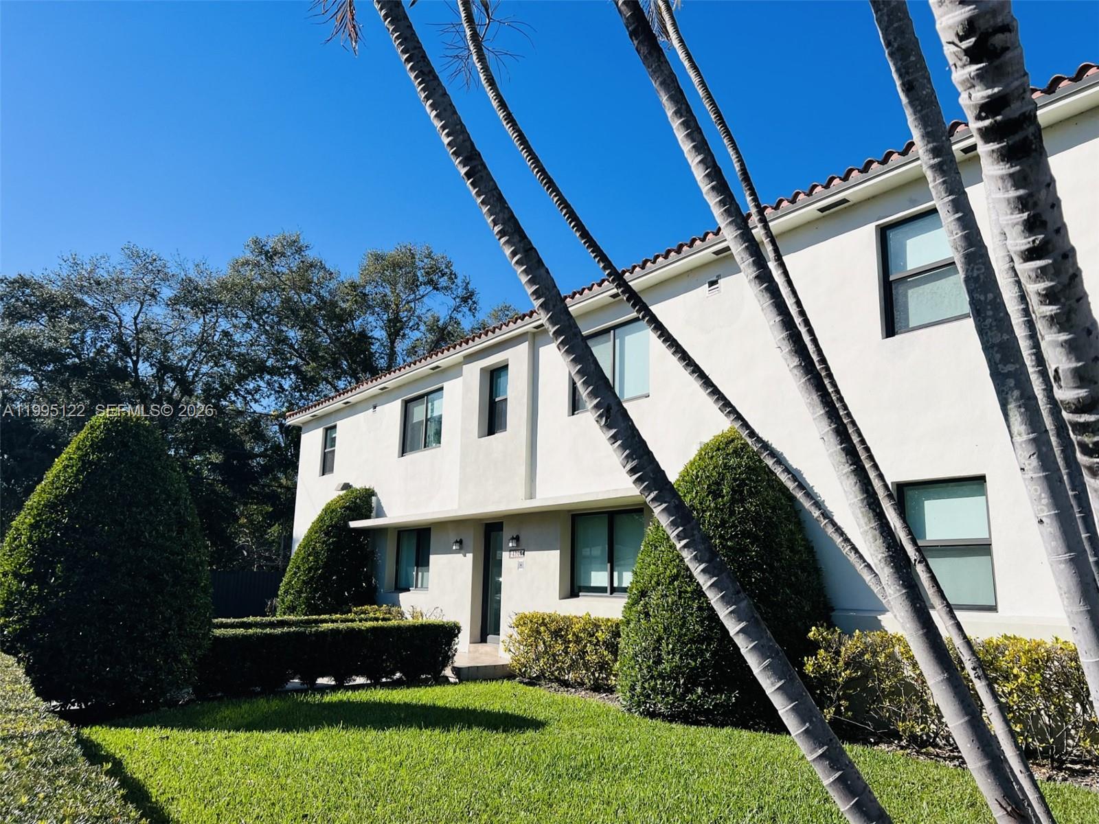 4203 Southwest 15th Street, Unit 2 Miami, FL 33145 - Photo 16 of 17 a front view of a house with a garden