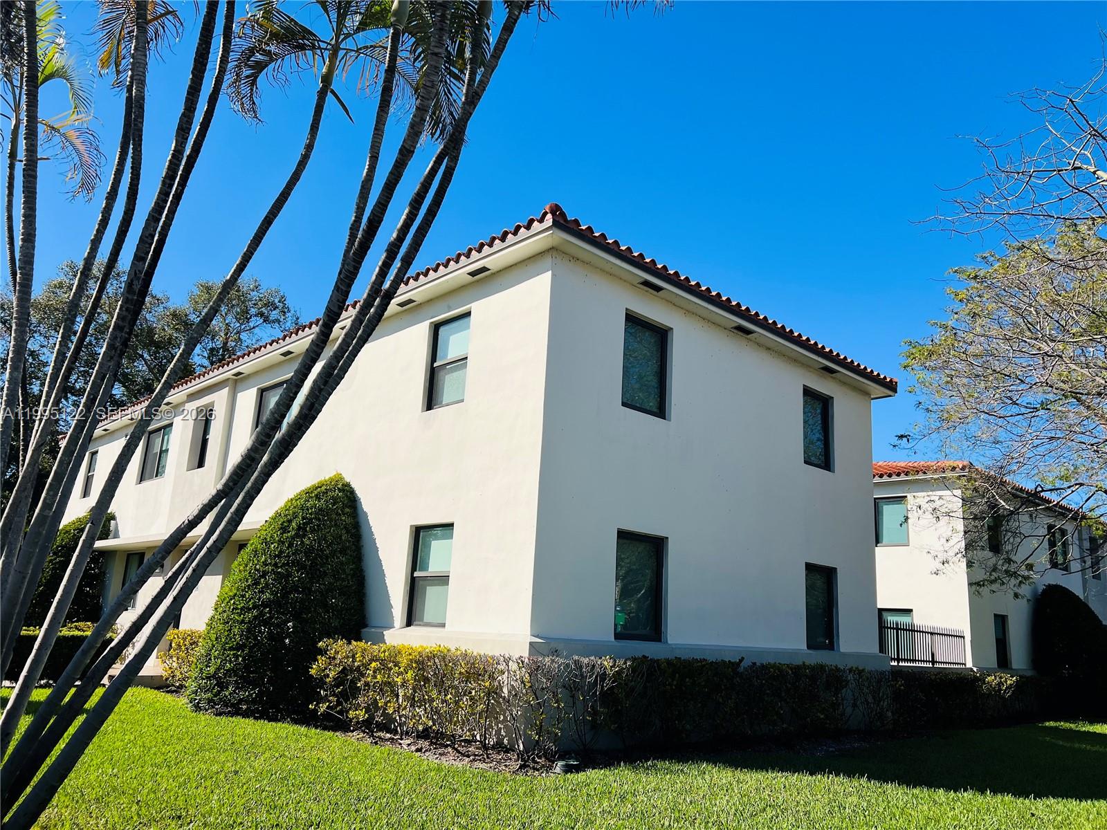 4203 Southwest 15th Street, Unit 2 Miami, FL 33145 - Photo 3 of 17 a front view of a house with a yard