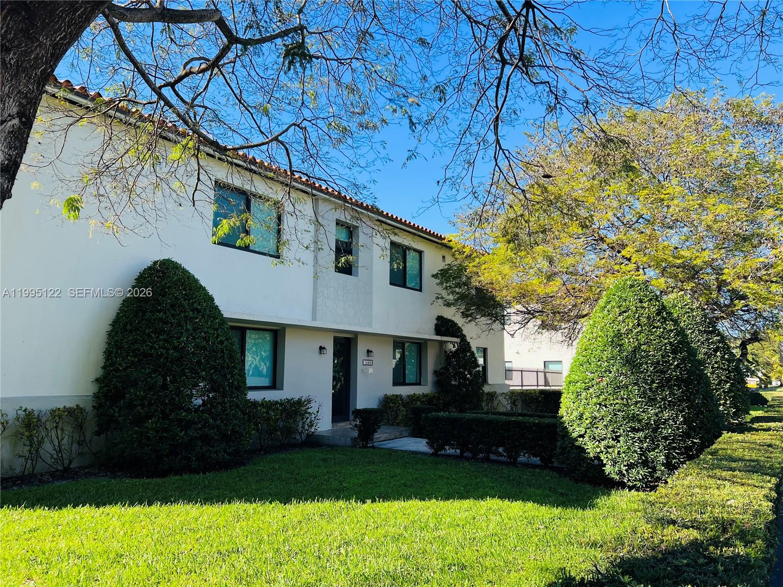 4203 Southwest 15th Street, Unit 2 Miami, FL 33145 - Photo 4 of 17 a front view of a house with a garden