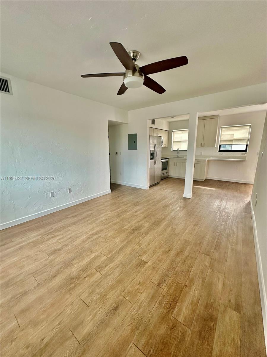 4203 Southwest 15th Street, Unit 2 Miami, FL 33145 - Photo 7 of 17 a view of a livingroom with a ceiling fan