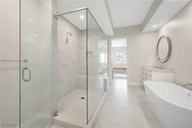 a bathroom with a toilet a sink and shower