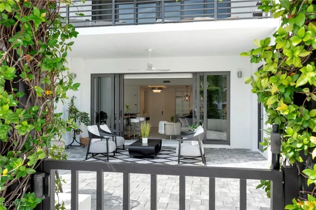 a dining room with furniture and wooden floor