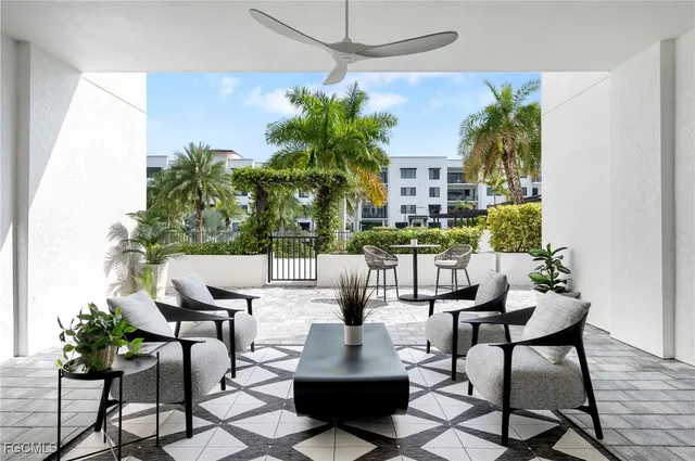 a view of a chairs and table in a patio