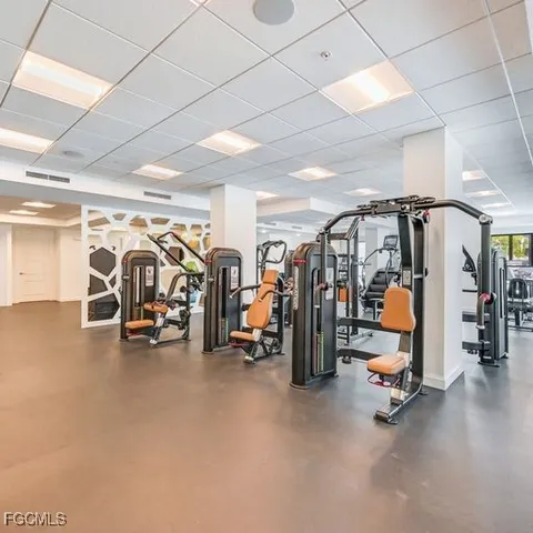 a room with lots of table and a large window