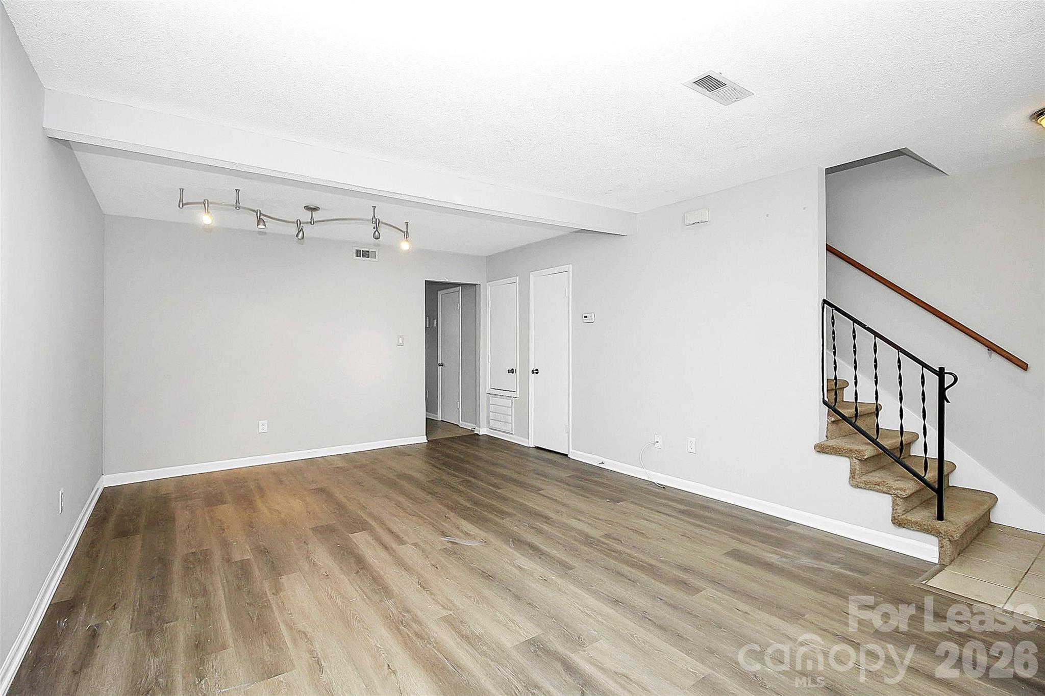11111 Park Road Charlotte, NC 28226 - Photo 2 of 9 a view of empty room with wooden floor