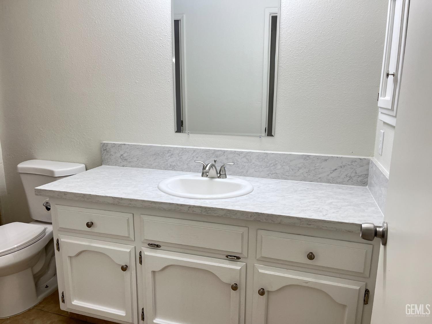 Undisclosed Address Bakersfield, CA 93311 - Photo 10 of 12 a bathroom with a sink and a toilet