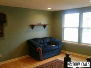 6633 Piney Path Road Charlotte, NC 28212 - Photo 2 of 6 a living room with furniture and a window