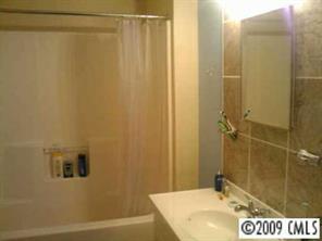 6633 Piney Path Road Charlotte, NC 28212 - Photo 6 of 6 a bathroom with a sink and a shower