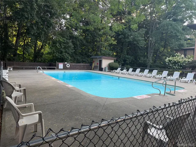 a view of a swimming pool with a patio