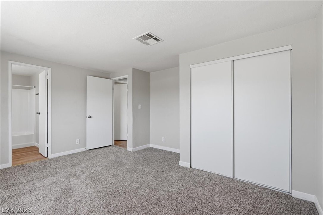 283 Aztec Lane Henderson, NV 89015 - Photo 16 of 21 Comfortable bedroom offers soft carpeting and ample closet space, ready for personalization.