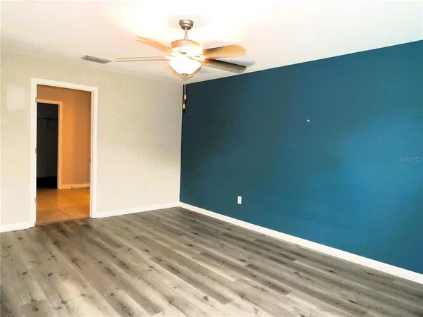 a view of a room with a fan