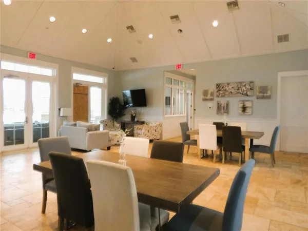 a living room with fireplace furniture and a flat screen tv