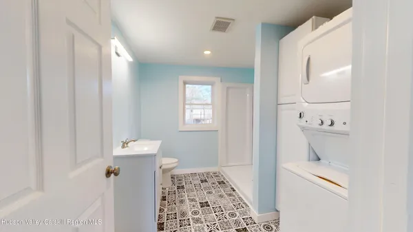 a bathroom with a bathtub and a toilet