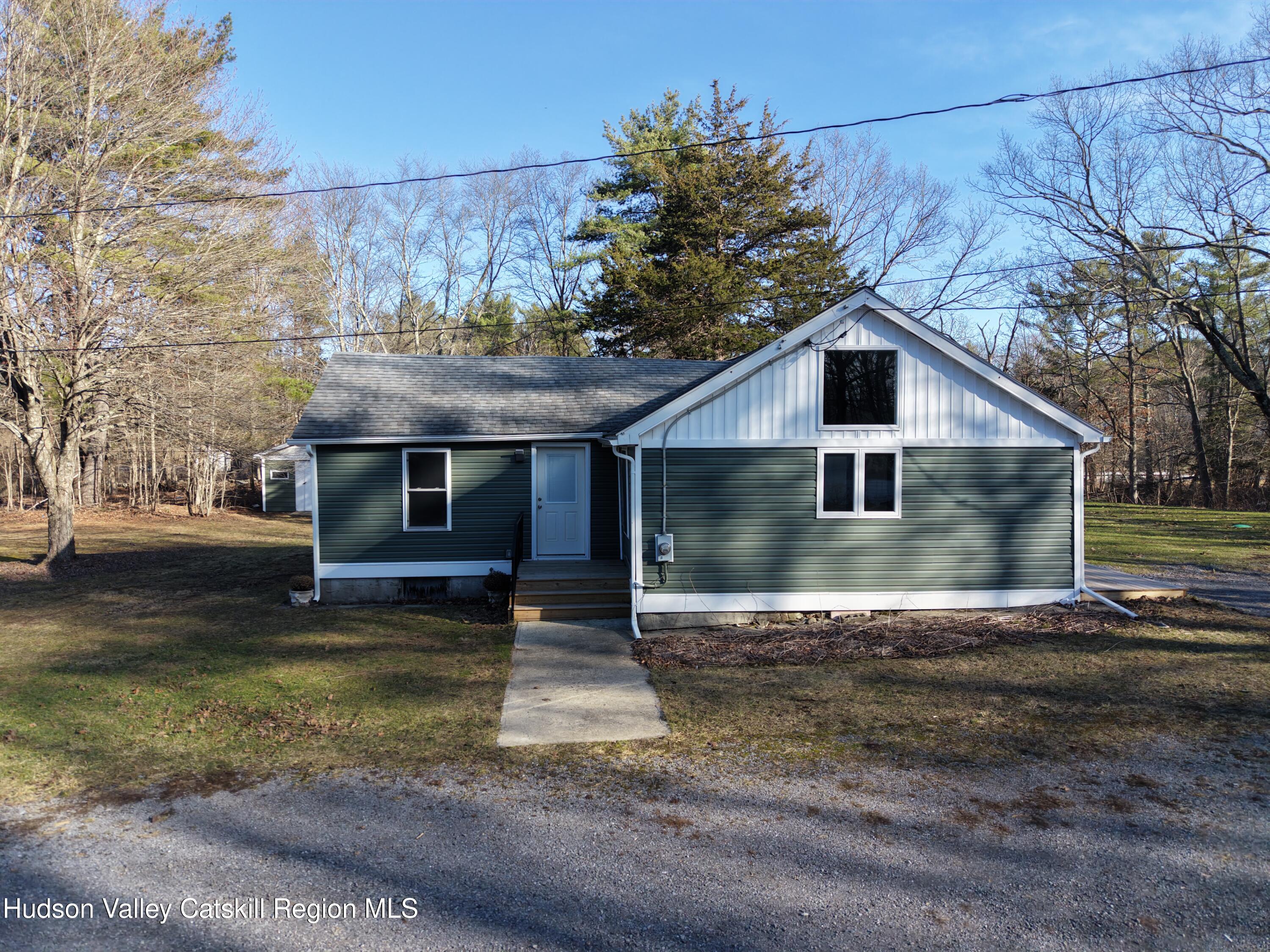79 Highway 145 Cairo, NY 12413 - Photo 19 of 23 a front view of a house with a yard