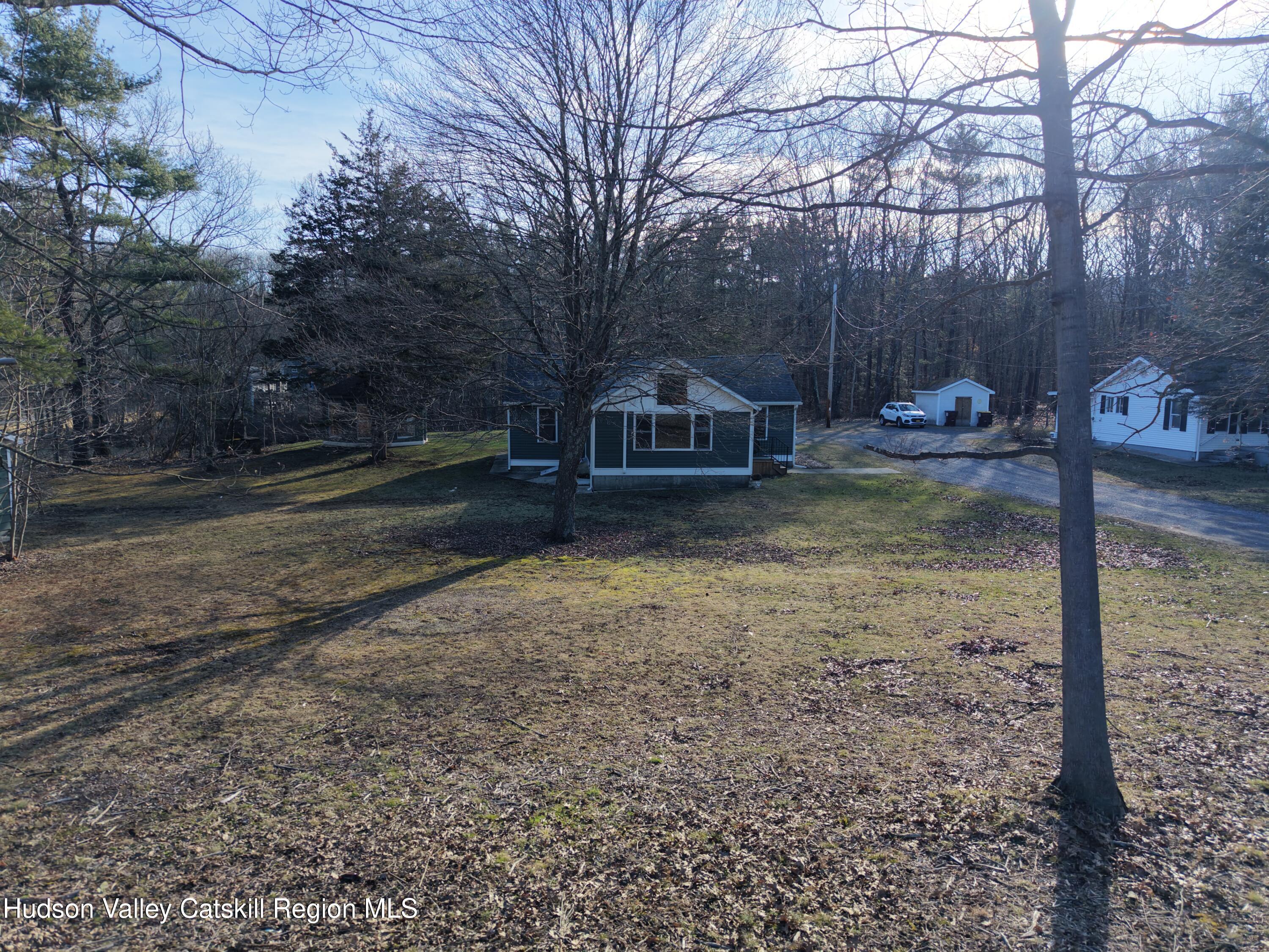 79 Highway 145 Cairo, NY 12413 - Photo 22 of 23 a view of a house with a yard
