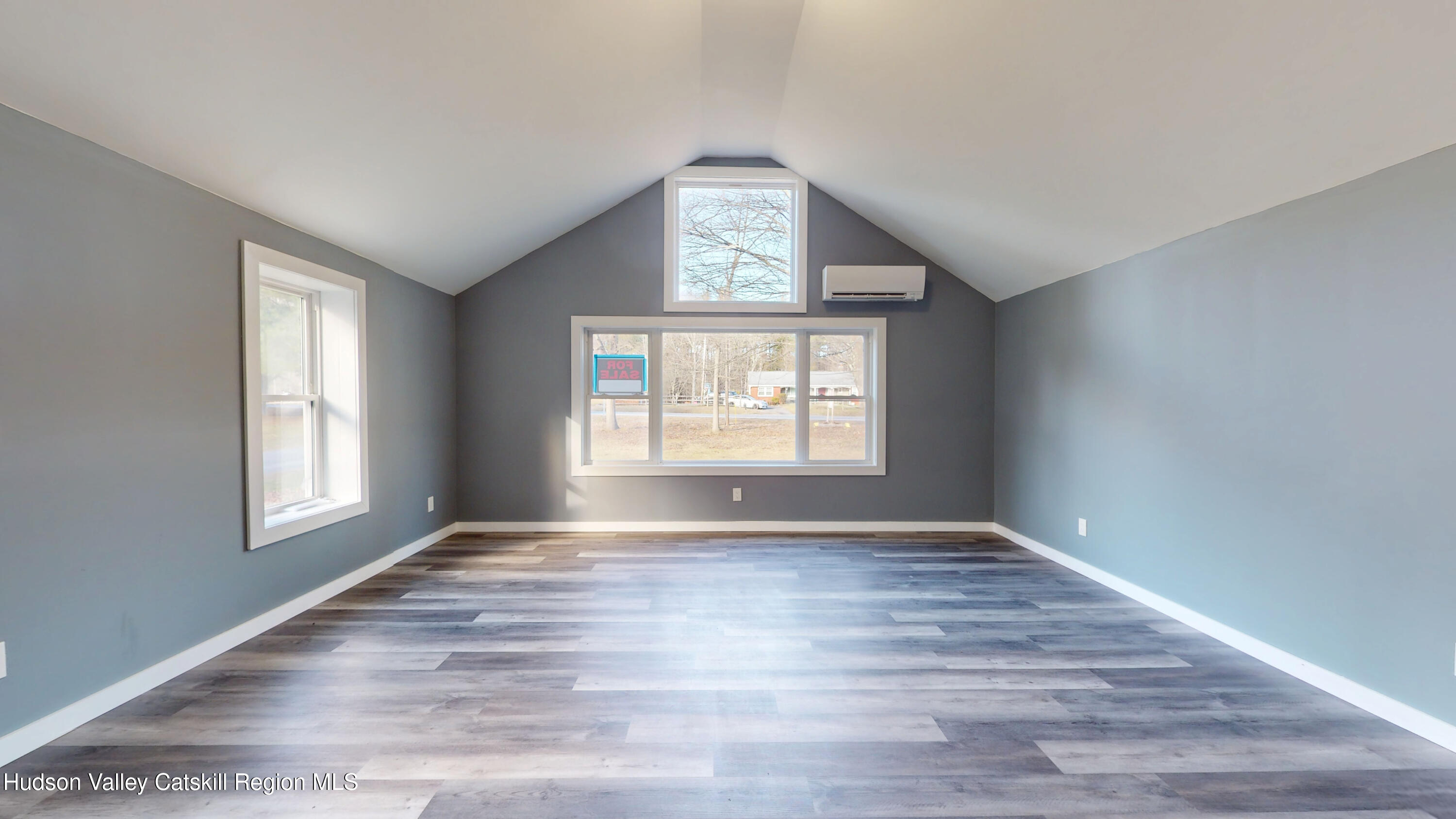 79 Highway 145 Cairo, NY 12413 - Photo 10 of 23 a view of an empty room with wooden floor and window